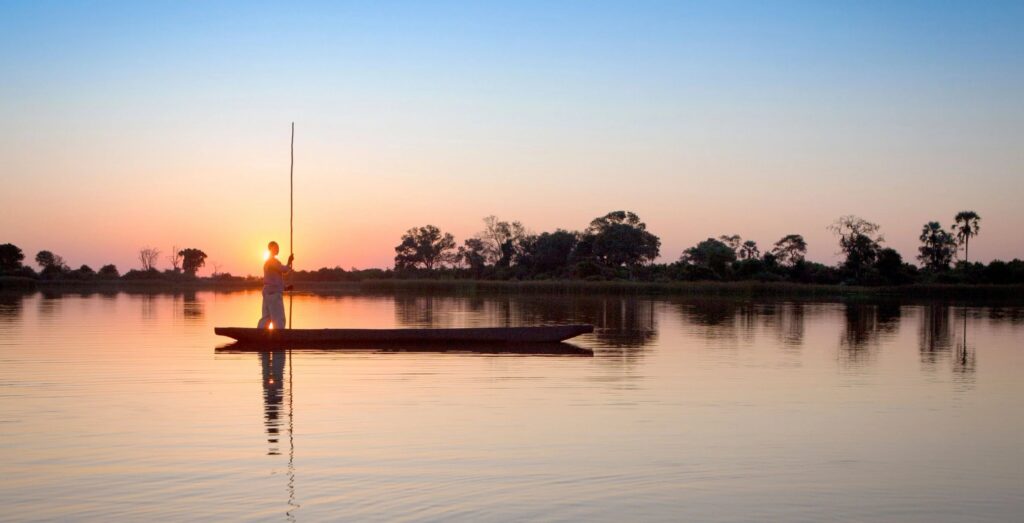 Mokoro in the wetland at sunset - Large